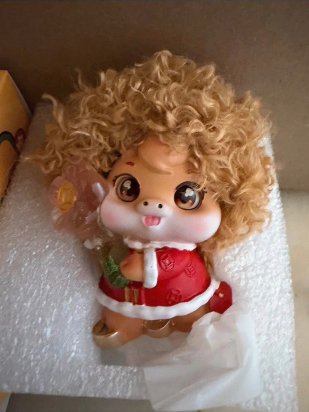 Porcelain cow figurine with hair